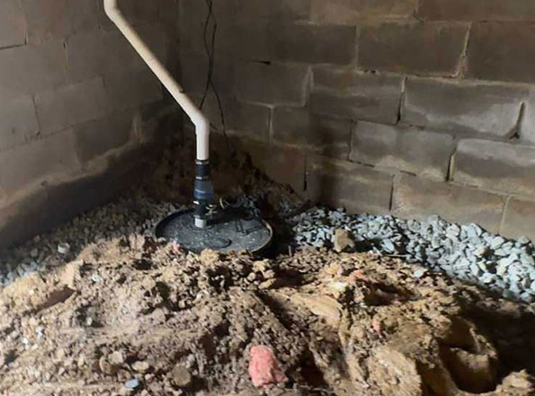 sump pump installed in a crawl space